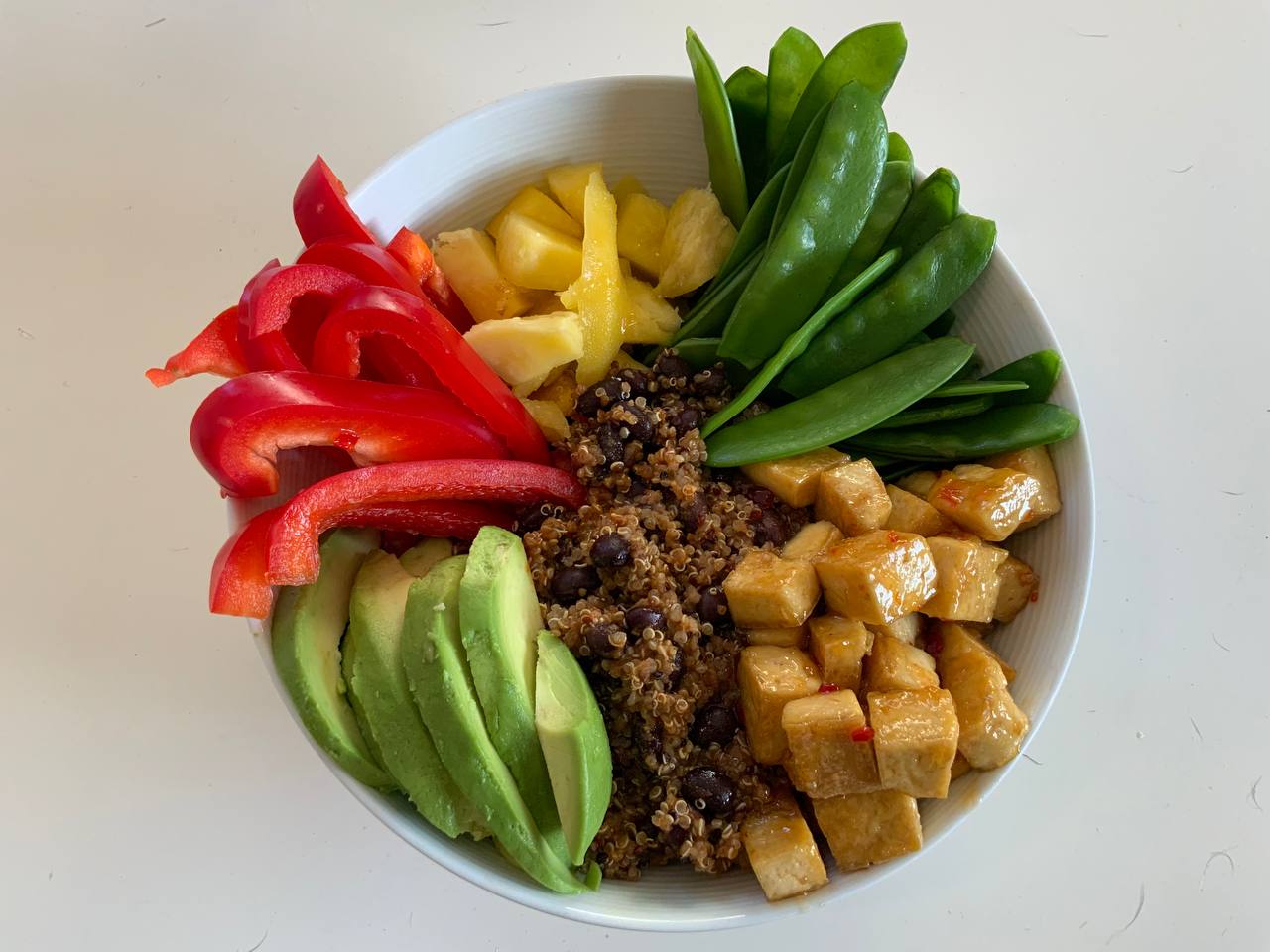 Colourful mango quinoa bowl